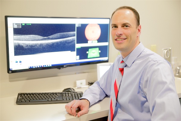 Dr. Snyder reading results from Optical Coherence Tomography (OCT) scan